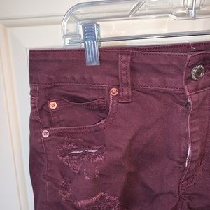 Maroon ripped mid waist shorts American eagle